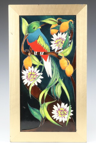 A contemporary Moorcroft panel decorated with a bird amongst flowers, impressed marks, monogrammed PH, 40cm x 20cm 