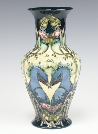 A contemporary Moorcroft cream and blue ground oviform vase decorated with peacocks, impressed marks, monogrammed VZ, 27cm 