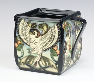 A contemporary Moorcroft biscuit box, the black ground decorated with owls and acorns, impressed marks (a second and without lid) 14cm 