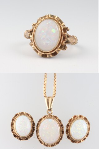 A 9ct yellow gold opal ring size L, a pair of ditto studs and a 9ct gold chain with opal pendant 40cm, gross weight 10.6 grams 