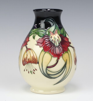 A Moorcroft Anna Lily pattern vase, designed by Nicola Slaney, impressed marks, dated '98, monogrammed ST, a second, 19cm 