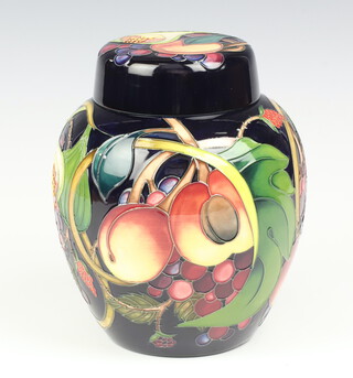 A Moorcroft Queens Choice pattern blue ground ginger jar and cover, designed by Emma Bossons, impressed marks, dated 2000, makers monogram, 21cm 