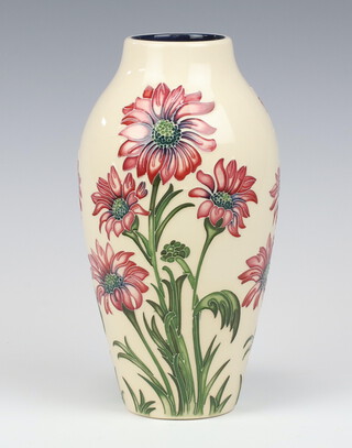 A contemporary Moorcroft cream ground oviform vase with impressed marks decorated with flowers 21cm 