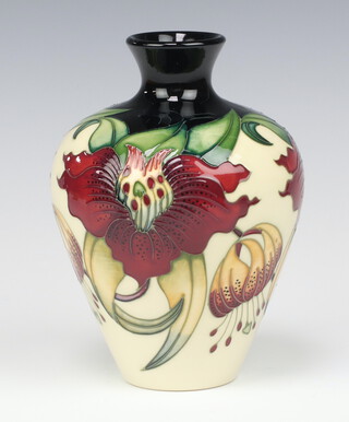 A Moorcroft Anna Lily cream ground vase, designed by Nicola Slaney, dated 1988, a second, 19cm 