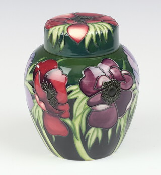 A Moorcroft Anemone Tribute pattern green ground ginger jar and cover, designed by Emma Bossons, impressed marks, trial, makers monogram MD, 16cm  