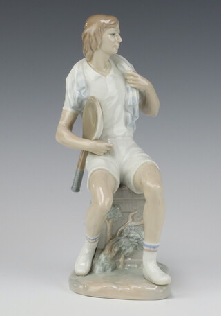 A Lladro figure of a seated male tennis player 27cm 