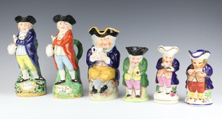 Two 19th Century Staffordshire Toby jugs - Hearty Good Fellow 28 cm, seated gentleman 26cm and 3 others 