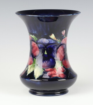 A William Moorcroft Pansies pattern blue ground waisted vase, impressed marks and signature 19cm 