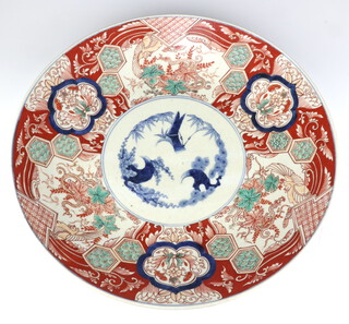 A large Japanese Imari charger decorated with flowers 47cm 