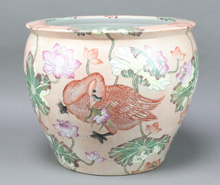 A 20th Century Chinese fish bowl, the interior decorated with carp amongst seaweed, the exterior decorated with ducks amongst flowers 47cm 