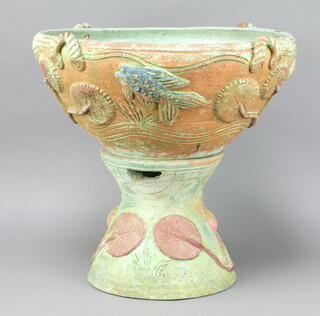 An earthenware jardiniere decorated with flowers on a waisted stand 46cm 