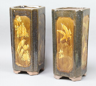 A pair of 1930's Chinese octagonal jardinieres/umbrella stands, decorated with birds amongst flowers 44cm 