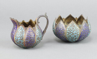 An Indian metal and enamelled flower head shaped sugar bowl 6cm x 9cm together with a ditto cream jug 8cm x 4cm 