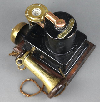 A metal and gilt metal wall mounted internal telephone marked B.I and H.C Limited, patent no. 2717806 