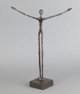 A bronze figure of a standing of a man with arms outstretched, raised on a square base 33cm h x 25cm 