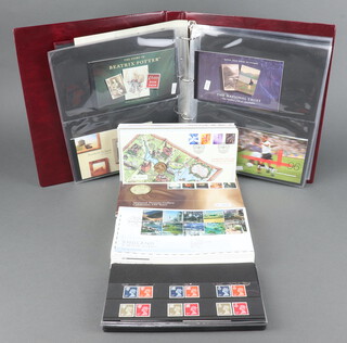 An album containing 32 GB presentation sets of stamps 1970, 1980-2004 together with a collection of GB presentation stamps and first day covers  