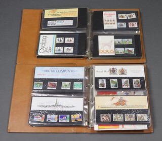 Two albums containing 112 GB presentation sets of stamps 