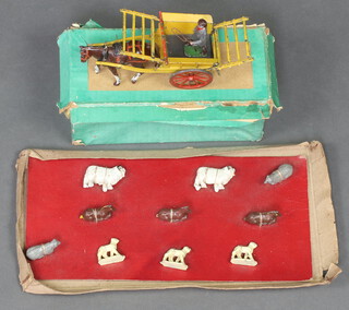 A collection of Timpo farmyard animals together with a Britains Tumbrel boxed 