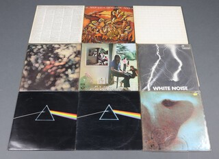 A collection of 1970's Prog Rock/Electronica vinyl LP's albums to include Pink Floyd Dark Side of The Moon 1977 gatefold 5th pressing x2, A10/B9 matrices, (one complete with poster/stickers, another missing 1 sheet of stickers), Pink Floyd -  Ummagumma, Meddle, Obscured by Clouds and The Wall, Faust - The Faust Tapes, Amon Duul II - Live in London, The White Noise  - An Electric Storm  