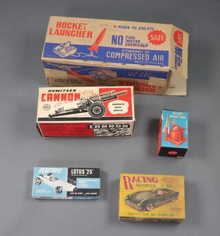 A MAR Howitzer cannon boxed, a Clifford Series racing sports car, a Geobra rocket money box, a Kimtoys Lotus 25 boxed and an American Space Designed no.175 rocket launcher boxed  