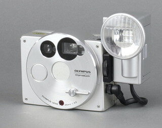 An Olympus O Product 35mm point and shoot camera with associated flash. 