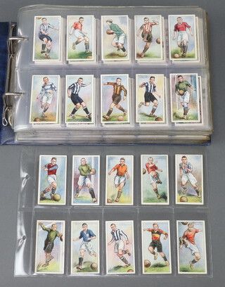 John Player and Sons cigarette cards, a Glen binder of complete sets to include Footballers 1928-29, From Plantation to Smoker, Struggle for Existence, Celebrated Bridges, Wild Animals of The World, Nature Series, National Flags and Arms (100), Riders of The World (100), Army Corps and Divisional Signs (150) and Regimental Uniforms (150)