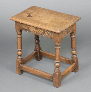 A 1930's bleached and carved oak joined stool, raised on turned and block supports 45cm h x 43cm w x 26cm d 