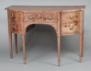 A Georgian mahogany break front sideboard fitted a drawer flanked by cupboard and cellarette drawer, raised on square tapered supports, spade feet 94cm h x 138cm w Ivory Exemption Certificate C4KAUBUQ