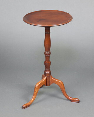 A 19th Century circular mahogany dish top wine table, raised on pillar and tripod supports 69cm h x 37cm diam.  