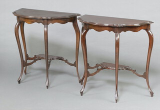 A pair of Edwardian mahogany 2 tier demi-lune console tables raised on cabriole supports 72cm h x 74cm w x 36cm d (formerly in one piece)  