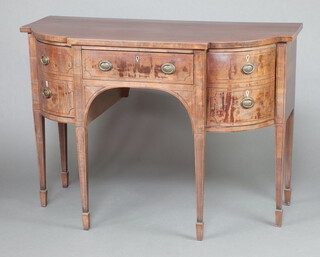 A Georgian mahogany bow front sideboard fitted a drawer flanked by cellarette drawer and cupboard, raised on square tapered supports, spade feet 94cm h x 134cm w x 63cm d Ivory Exemption Certificate 5UJSCT3P