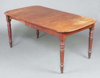 A William IV mahogany extending dining table with 2 extra leaves on turned supports, brass caps and casters 72cm h x  89cm w x 112cm l when closed x 164cm l when extended  