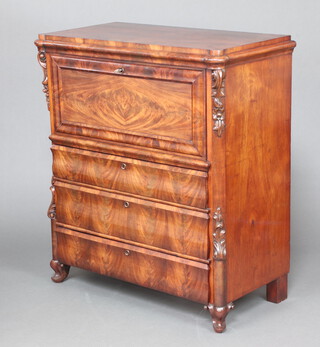 A 19th Century Continental mahogany escritoire with quarter veneered top, the well fitted interior with 6 short drawers and cupboard, the base fitted 3 drawers with vitruvian scroll decoration to the side 120cm h x 104cm w x 55cm d 