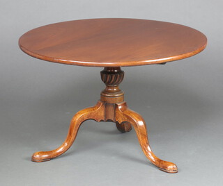 A Georgian  circular mahogany tea table raised on turned column and tripod base 51cm h x 78cm diam.  