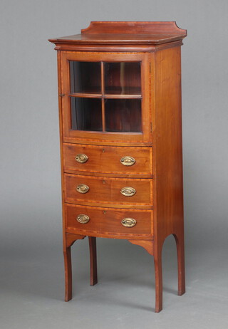 An Edwardian inlaid and crossbanded mahogany bow front display cabinet with raised back fitted a cupboard enclosed by astragal glazed panelled door, above 3 drawers, raised on outswept supports 126cm h x 52cm w x 39cm d 