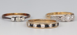 Three 9ct yellow gold diamond and gem set rings, sizes N, N and P, gross weight 6.3 grams 