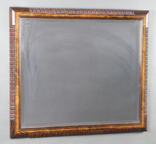 An Edwardian rectangular bevelled plate mirror contained in an inlaid rosewood frame 73cm x 80cm 