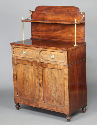 A Regency mahogany secretaire chiffonier, the raised back fitted a shelf, the fall  front revealing pigeon holes and drawers, the base enclosed by a pair of panelled doors, raised on turned supports 140cm h x 93cm w x 44cm d Ivory Exemption Certificate HHGK7H4Q