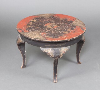 A circular Japanese black and red lacquered occasional table decorated figures, raised on cabriole supports 40cm x 60cm 