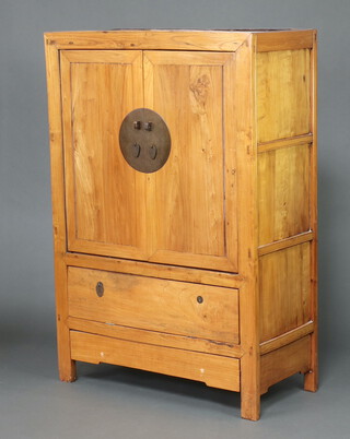 A Chinese hardwood cabinet enclosed by a panelled door, the base with fall front 169cm w x 115cm w x 55cm d 