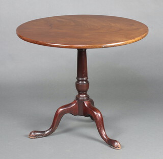 A 19th Century circular mahogany snap top tea table, raised on pillar and tripod base 68cm h x 80cm diam. 