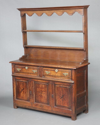 An 18th Century oak dresser base fitted 2 drawers above double cupboards inlaid a star, with later associated raised back with moulded cornice, 168cm h x 126cm w x 44cm d 