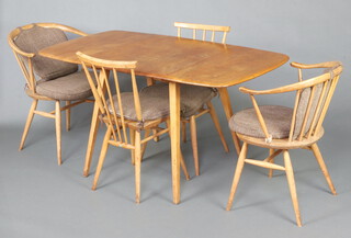 Ercol, a mid-century elm and beech dining suite comprising drop flap table (model 383) 71cm h x 74cm w x 63cm when closed x 137cm l when extended, a pair of elm and beech Windsor bow top carver chairs 76cm h x 56cm w x 41cm d (seats 27cm x 23cm) and a pair of Windsor bow top standard chairs (all chairs with original labels) 