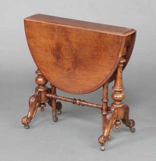 A Victorian oval walnut Sutherland table raised on turned supports 59cm h x 61cm w x 12cm  