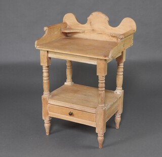 A Victorian stripped and polished pine wash stand with raised back and 3/4 gallery, raised on turned supports, the base fitted a drawer, 97cm h x 62cm w x 48cm d 