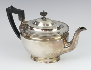 A silver teapot of plain form with ebony mounts Sheffield 1913, 619 grams gross 