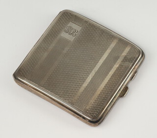 An Art Deco silver cigarette case with engraved decoration and monogram Birmingham 1929 104 grams gross  