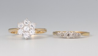 An 18ct yellow gold illusion set diamond ring size Q, 2.1 grams, a yellow metal 585 paste set ring size R 1/2, 3.3 grams 