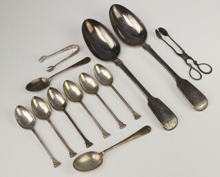 A pair of Victorian silver sugar nips London 1885 and minor spoons etc, 309 grams 