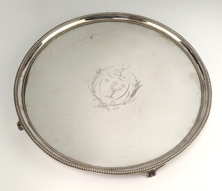 A George III circular silver salver with beaded rim and engraved armorial, London 1787, Maker Elisabeth Jones, 36cm, 1275 grams 